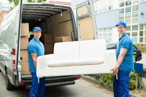 Removal team planning a move in Colliers Wood near local flats and streets