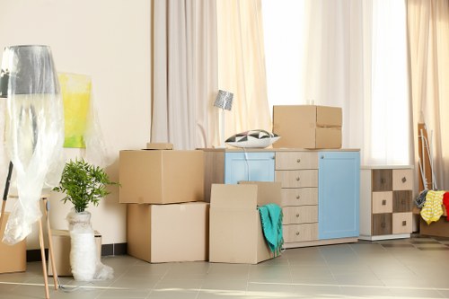 Office removals planning in Colliers Wood with business equipment and boxes