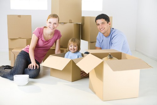 Man with van moving boxes and furniture in Colliers Wood