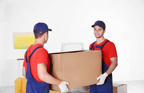 House removal team preparing a moving van in Colliers Wood