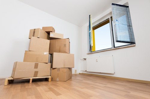 Charity donation boxes and recyclable materials from a Colliers Wood move