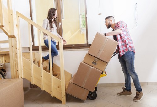 Professional movers handling a flat removal near Colliers Wood