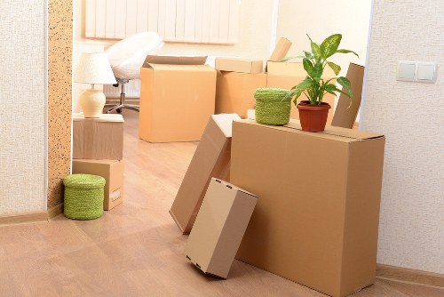 Packed office equipment and furniture ready for a local commercial move