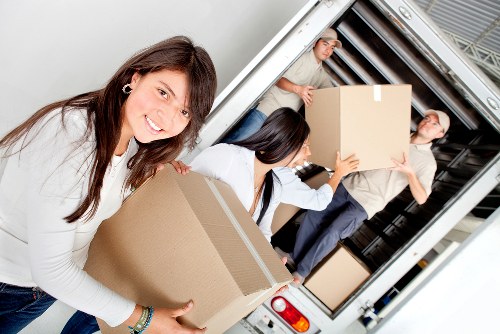 Moving day preparation with sturdy boxes and protective wrapping