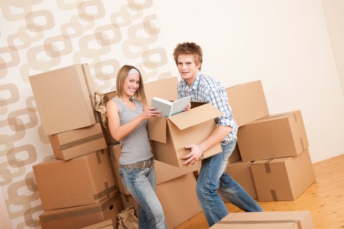 Commercial moving team handling desks and equipment during an office move