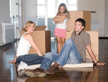 Moving boxes and furniture ready for unloading at a new home